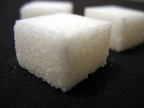 A close up of a sugar cube.