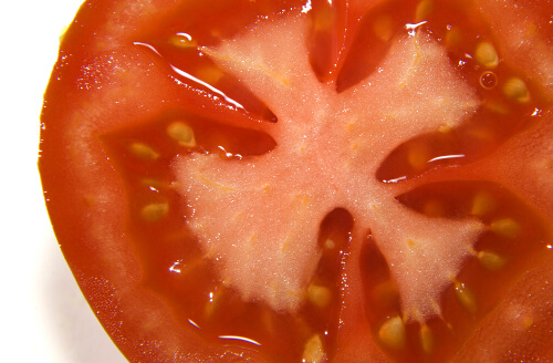 Tomato is good for acne scars and skin health.