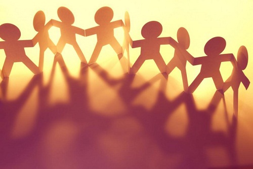 paper figures holding hands