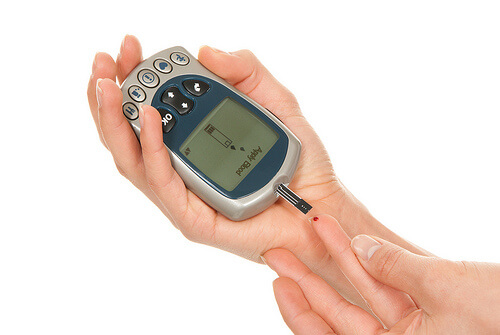 Someone measuring their blood sugar levels