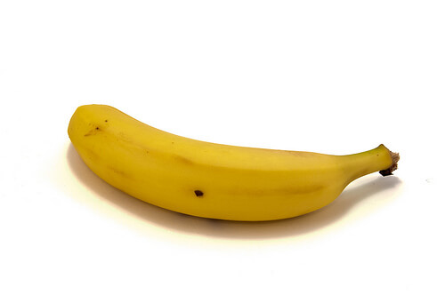 A single banana on a white background.