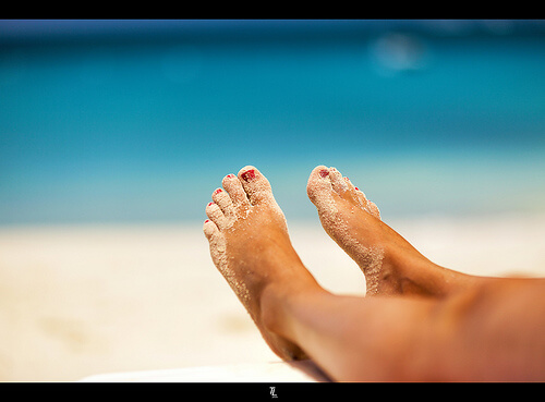 Beautiful feet in the sand
