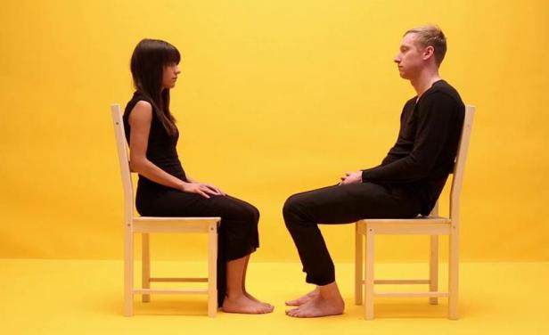 Two people facing each other