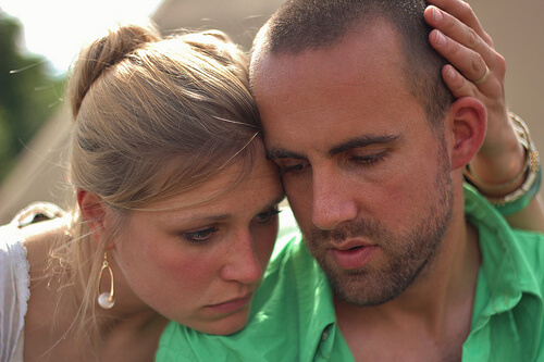 Woman comforting a man