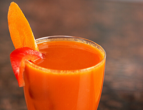 A glass of carrot and orange juice.