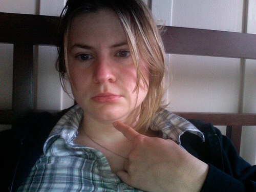 Woma pointing at her throat