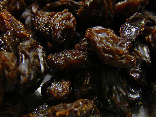 Close up of dark colored raisins benefits of raisins