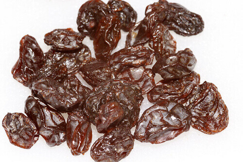 Raisins with a white background benefits of raisins