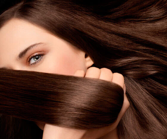 Woman with gorgeous brown hair straighten hair naturally