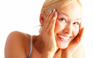 woman holding her face in her hands