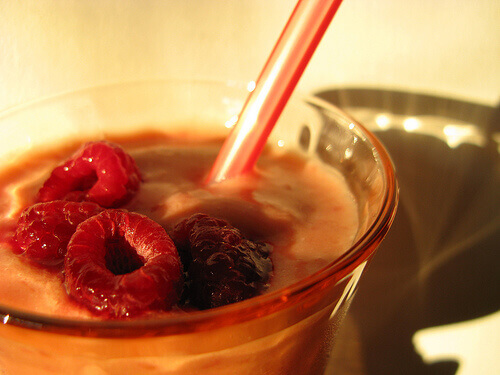 Raspberry smoothie with straw iced nutritious and satisfying drinks