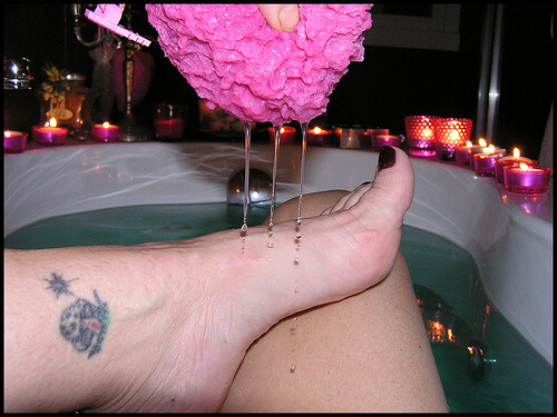 A woman soaking her feet.