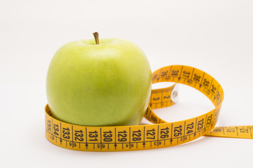 apple and measuring tape