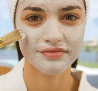 woman applying a face mask
