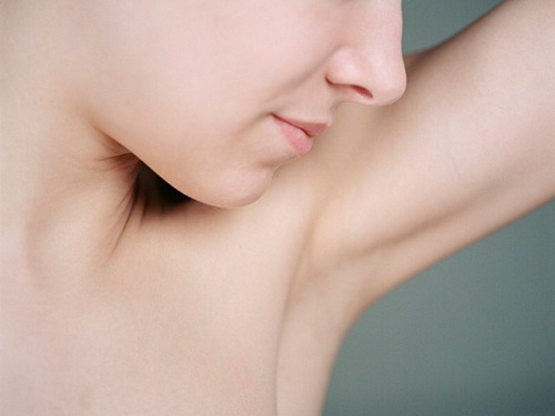 Woman's face and armpit