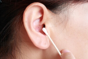 Ear cleaning with a Q-tip