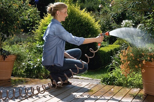 Woman watering her garden