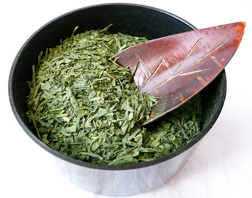 Bowl of green tea leaves