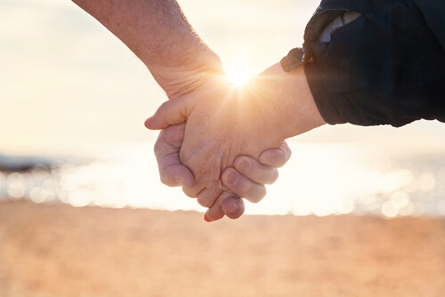 Couple holding hands