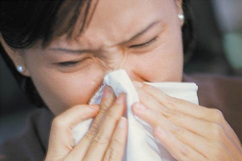 Lady blowing her nose