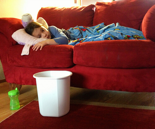 Sick child laying on a couch