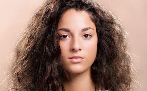 Girl with brown, frizzy hair