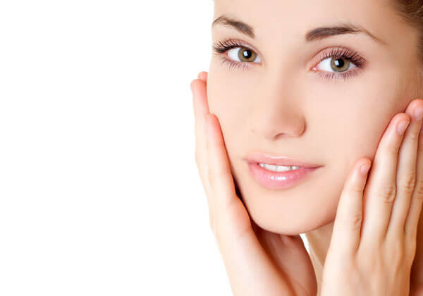 Woman with her hands on her cheeks