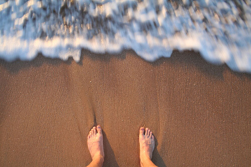 Get beautiful legs by walking on the beach.