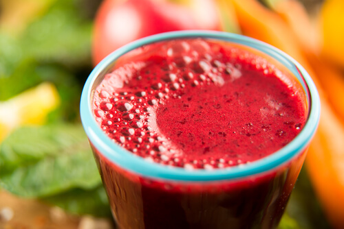 A glass of red fruit juice