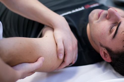 Chiropractor working on man