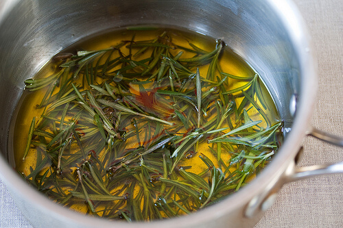 Boiling rosemary in a pan.