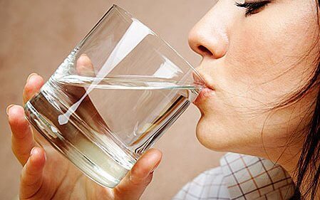 Woman drinking water from a glass