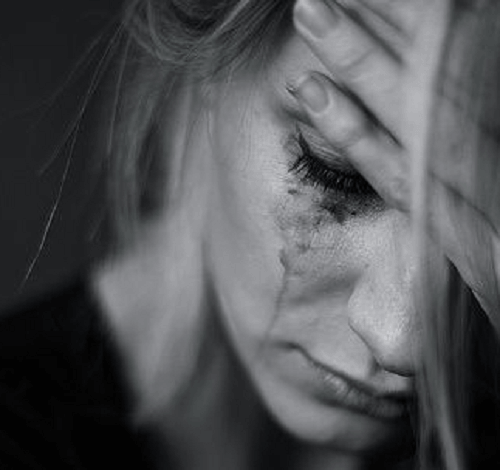 This woman is in the process of overcoming grief and pain.
