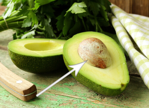 Arrow pointing at an avocado seed