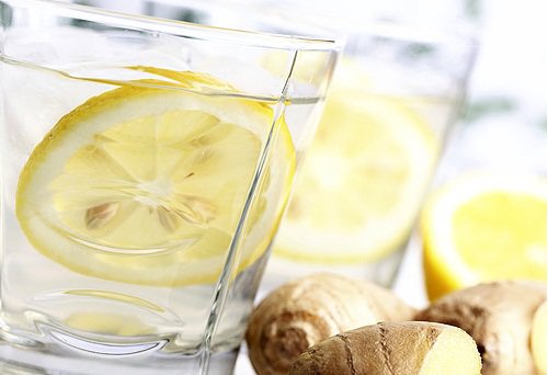 Lemon and ginger in a glass of water.