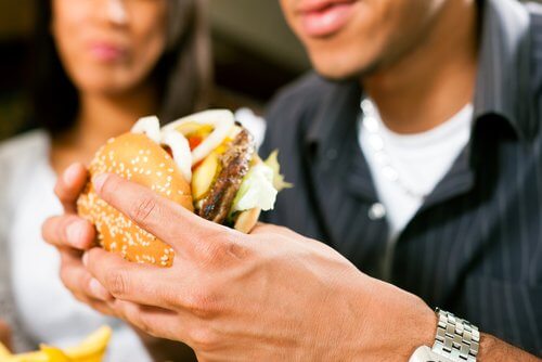 Man eating a fast food hamburger