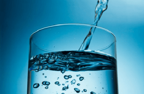 Pouring water into a glass