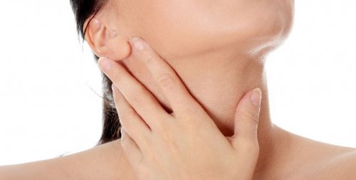 Woman with her hand on her neck
