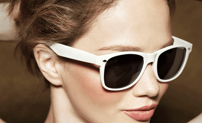 woman wearing white sunglasses, feeling whole