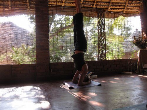 A woman doing yoga to improve her circulation and prevent varicose veins