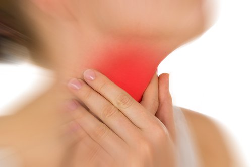 A woman with throat pain.