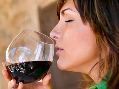 Woman doing a wine tasting.