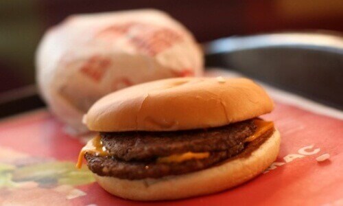 Hamburgers on a plate foods that make you age faster