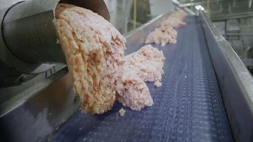 Making chicken nuggets on the assembly line