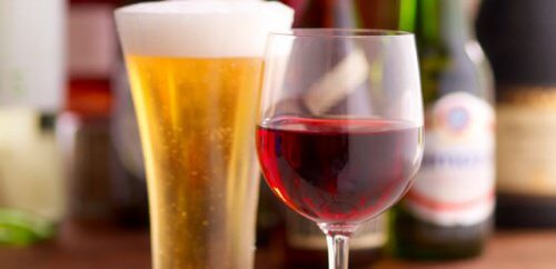 A glass of wine and a glass of beer.