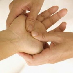 A hand getting a massage to help with the tingling sensation
