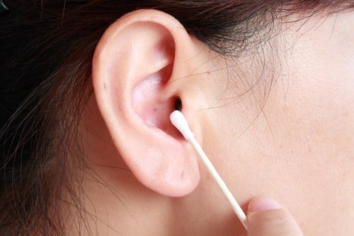 Removing earwax with a q tip