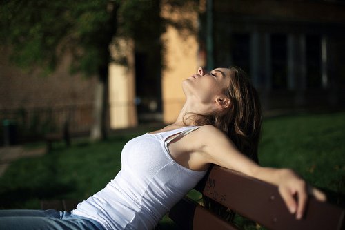 A woman asleep in the sun.