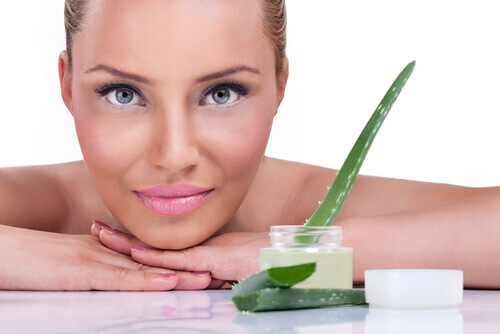 A woman with some aloe vera cream.