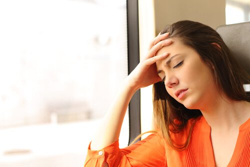 A woman with a headache.
